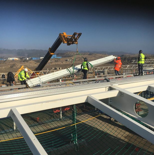 Lifting roof panels into place